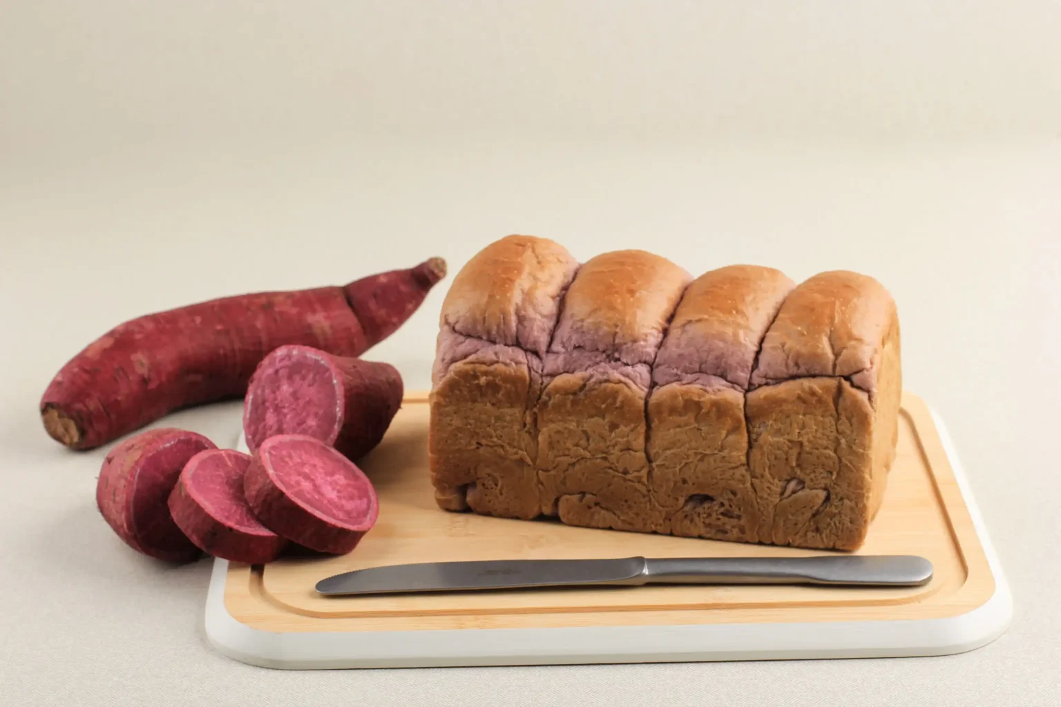 homemade-purple-bread-made-from-japanese-purple-sweet-potato-with-natural-color-concept-healthy-diet-bakery-copy-space-text-recipe-white-background (Web H)